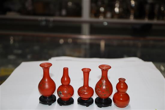 A group of four Chinese lacquer wood miniature vases and a similar pottery double gourd vase (5)